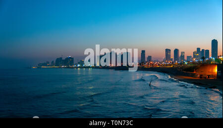 Israel, Tel Aviv beach front and skyline as seen from south, from Jaffa at dawn Stock Photo