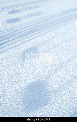 Playground swing in Wanlockhead village in the morning snow. Scotlands ...