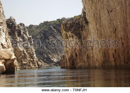 Boat ride through water gorge on Narmada river at Bhadeghat, Madhya Pradesh, India Stock Photo