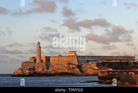 The historic lighthouse and fort called Morro Castle or El Morro (Castillo de los Tres Reyes del Morro) at the entrance to the harbor in Havana, Cuba. Stock Photo