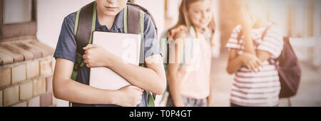 Pupil mocked in the school playground Stock Photo