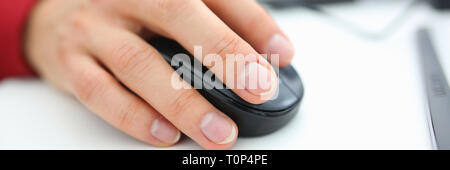 Male hand used computer mose holding in arm Stock Photo