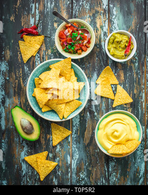 Nachos and assorted dips Stock Photo