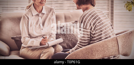 Smiling therapist with patient Stock Photo