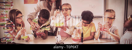 Pupils learning science with teacher Stock Photo