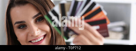 Female arm hold bunch of credit cards Stock Photo