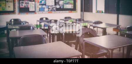 Empty classroom with desks and chairs Stock Photo