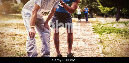 Exhausted senior man in park Stock Photo