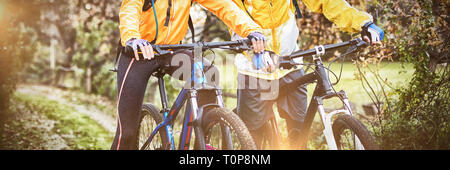 Biker couple cycling in countryside Stock Photo