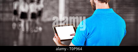 Male sports teacher using digital tablet Stock Photo