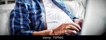 Portrait of senior man using laptop Stock Photo