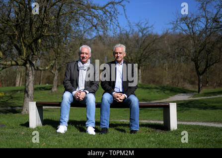 Gelsenkirchen, Germany. 21st Mar, 2019. Erwin (l) and Helmut Kremers sit on a bench on the grounds of the Haus Leythe golf club. The football twins Kremers celebrate their 70th birthday on 24 March 2019. (to dpa popstars of football: The indomitable Kremers twins turn 70 from 22.03.2019) Credit: Ina Fassbender/dpa/Alamy Live News Stock Photo