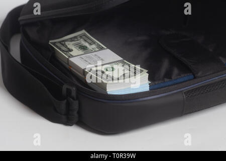 Open briefcase with one million dollars bills with tape on white background Stock Photo