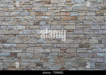 brown and grey carved stone wall Stock Photo