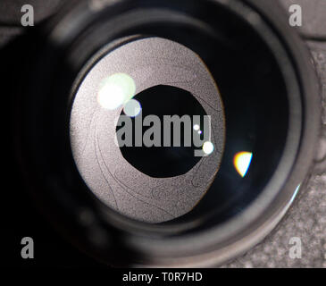 The diaphragm of a camera lens aperture. Selective focus with shallow depth of field. Color toned image. Stock Photo