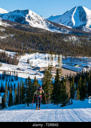 Alpine Touring skier at Monarch Mountain ski & snowboard resort skinning up the mountain; Continental Divide in Colorado, USA Stock Photo