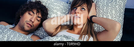 Man snoring and his wife annoyed Stock Photo
