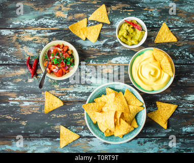 Nachos and assorted dips Stock Photo