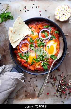 Shakshuka with pita bread Stock Photo