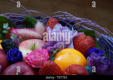Background of flowers, fruits and berries. Edible bouquet. A bouquet of flowers close-up. Stock Photo