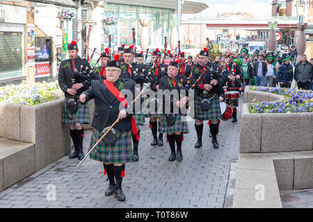 The annual St Patrick’s Day Parade from The Irish Club in Orford Lane to ‘The River of Life’ in Bridge Street. A short service remembered the 25th ann Stock Photo