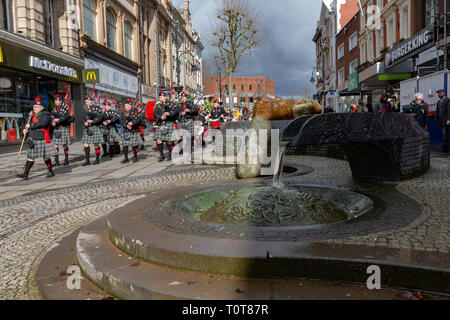 The annual St Patrick’s Day Parade from The Irish Club in Orford Lane to ‘The River of Life’ in Bridge Street. A short service remembered the 25th ann Stock Photo