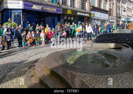 The annual St Patrick’s Day Parade from The Irish Club in Orford Lane to ‘The River of Life’ in Bridge Street. A short service remembered the 25th ann Stock Photo