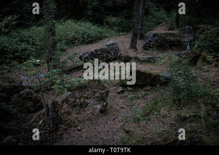 Large stones in the woods awaiting storm Stock Photo