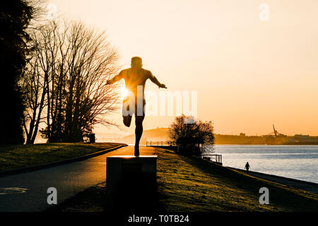 Sunrise, Harry Jerome statue, Stanley Park, Vancouver, British Columbia, Canada Stock Photo