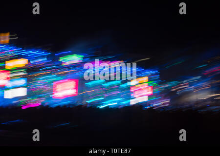 Abstract blurred light lines on black background. Light trails against dark background. Stock Photo