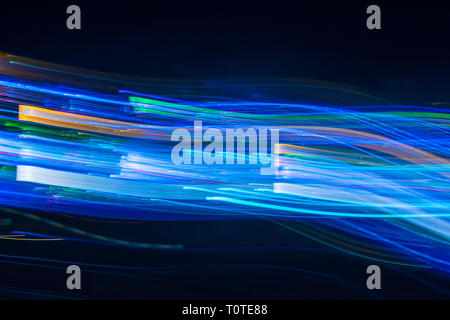 Abstract blurred light lines on black background. Light trails against dark background. Stock Photo