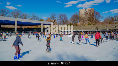 Kids and adults are enjoying ice-skating in Prospect park, NY, Spring 2019 Stock Photo
