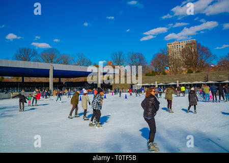 Kids and adults are enjoying ice-skating in Prospect park, NY, Spring 2019 Stock Photo