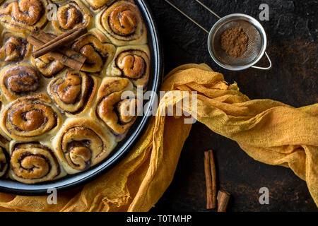 Close up of baked cinnamon rolls with sugar syrup on top Stock Photo