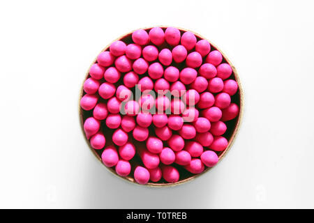 Overhead shot of a bunch of pink-tipped matchsticks, isolated on white background, Stock Photo