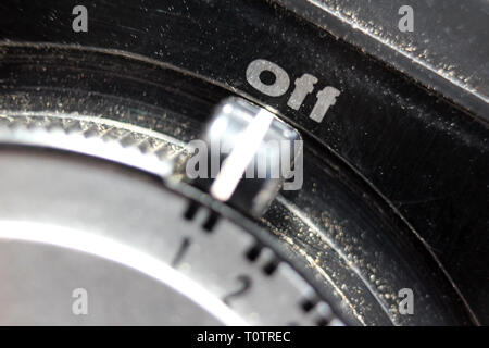On-off switch detail from vintage photographic light meter Hanimex PR-120 made in Japan. Stock Photo