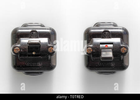 Antique two switches position on-off, bakelite, isolated on white background, close-up Stock Photo