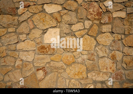 Masonry wall stonewall in Mediterranean background Stock Photo