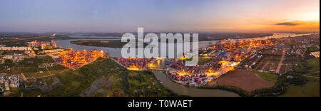 Top view aerial of Cat Lai port container, Ho Chi Minh City with development buildings, transportation, energy power infrastructure, Vietnam. Panorama Stock Photo