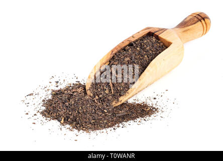 Dried Thai tea mixed with spices on a wooden scoop Stock Photo
