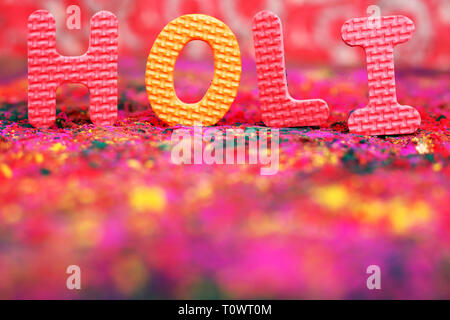 Portrait of organic multi color for holi festival. Isolated on the colorful background. Stock Photo