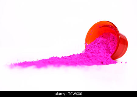 Picture of pink organic holi color for holi fun. Isolated on the white background. Stock Photo