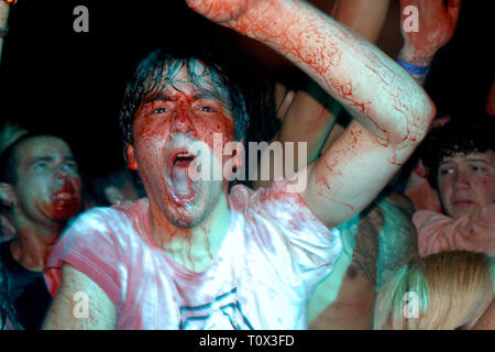 Gwar fans are shown splattered in fake blood during a 'live' concert performance. Stock Photo