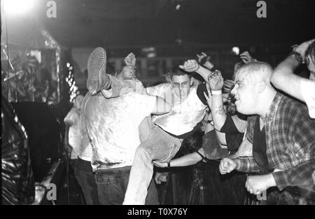 Stage diving madness is captured during a GWAR 'live' concert performance. Stock Photo