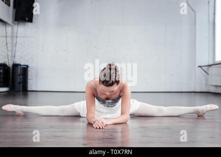 Nice good looking woman practicing her splits Stock Photo