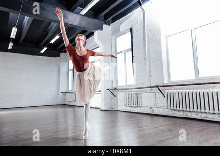 Beautiful young woman training in the dancing hall Stock Photo