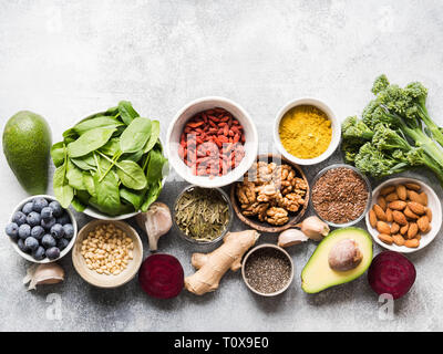 Healthy clean food - vegetables, fruits, nuts, superfoods on a gray background. Healthy eating concept. Stock Photo