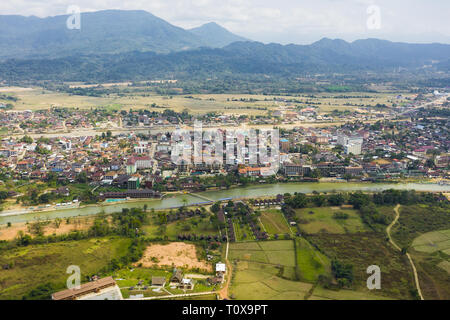 View from above, aerial view of the beautiful city of Vang Vieng. Vang Vieng (also Vang Viang) is a tourist-oriented town in Laos. Stock Photo