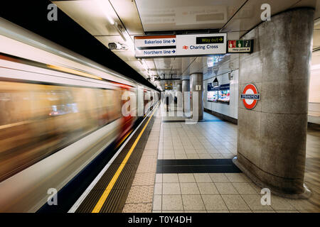 LONDON - MARCH 20, 2019: Train arriving at Embankment at Westminster tube station in London Stock Photo