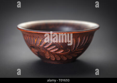 new clay plate closeup on black background Stock Photo